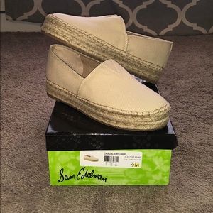 Women’s size 9 ivory canvas slip on shoes.
